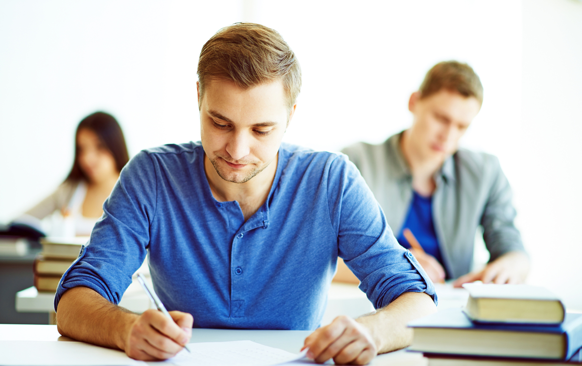 Serious student during written exam